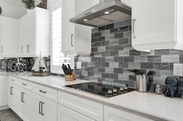 7 Marden Dr, Ormond Beach, FL 32176 - kitchen featuring wall chimney range hood, decorative backsplash, and white cabinets