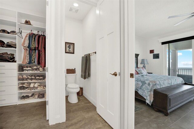 7 Marden Dr, Ormond Beach, FL 32176 - bathroom with connected bathroom, toilet, a walk in closet, and tile patterned floors