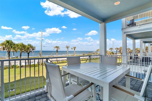 7 Marden Dr, Ormond Beach, FL 32176 - balcony with view of water and beach and outdoor dining area