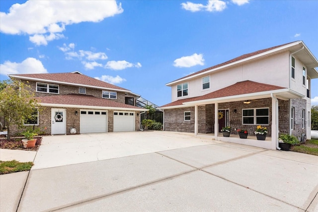 traditional home with concrete driveway and brick siding