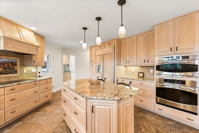 kitchen featuring light brown cabinetry, a kitchen island, double oven, and black electric stovetop