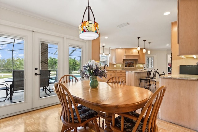 dining area featuring recessed lighting, visible vents, and ornamental molding