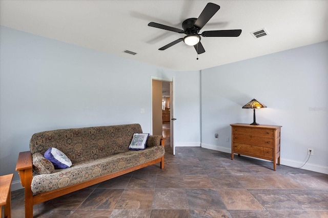 sitting room with baseboards, visible vents, and ceiling fan
