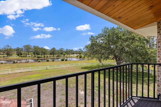 balcony featuring a water view