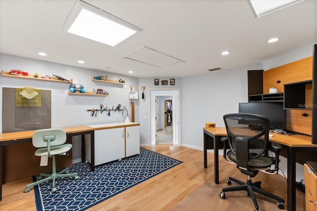 office space featuring visible vents, recessed lighting, baseboards, and light wood-type flooring