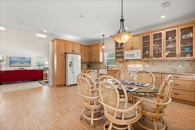 dining room featuring recessed lighting, visible vents, and light wood-type flooring