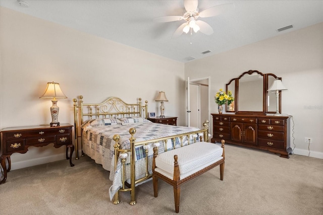 bedroom with baseboards, visible vents, ceiling fan, and light colored carpet