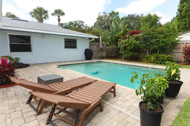 view of pool with a patio, a fenced in pool, and a fenced backyard
