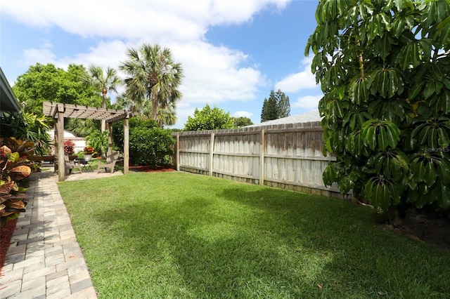 view of yard with a patio, a pergola, and a fenced backyard