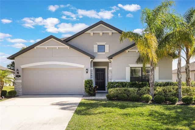 traditional home featuring an attached garage, a front lawn, stucco siding, and driveway