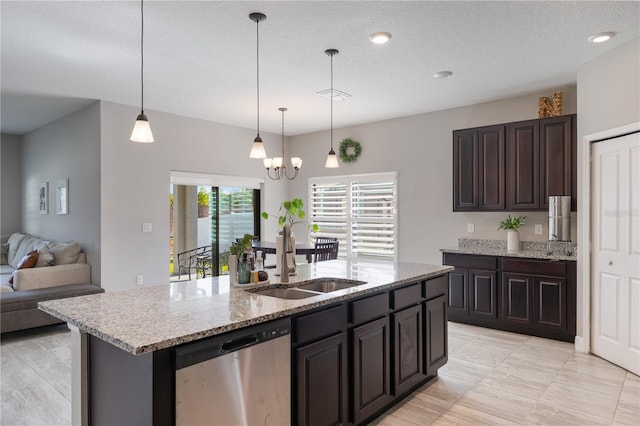 kitchen with stainless steel dishwasher, an inviting chandelier, open floor plan, a center island with sink, and a sink