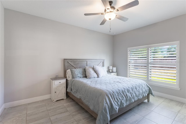 bedroom with baseboards and ceiling fan