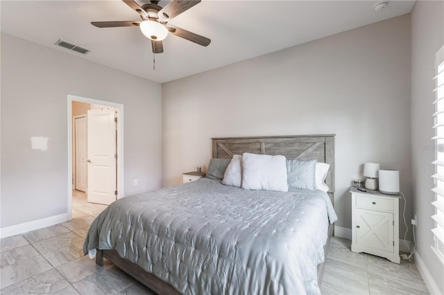 bedroom featuring baseboards, a ceiling fan, and visible vents