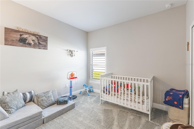 carpeted bedroom with baseboards