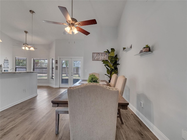 dining room with french doors, baseboards, a ceiling fan, and wood finished floors