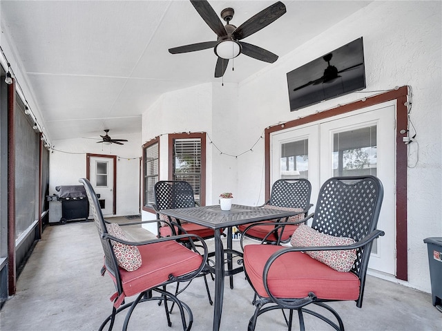 view of patio / terrace with a ceiling fan, french doors, and outdoor dining space