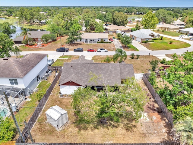 birds eye view of property with a residential view