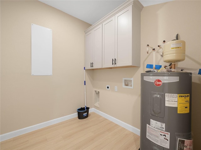 laundry area featuring electric water heater, hookup for an electric dryer, light wood-style flooring, cabinet space, and baseboards