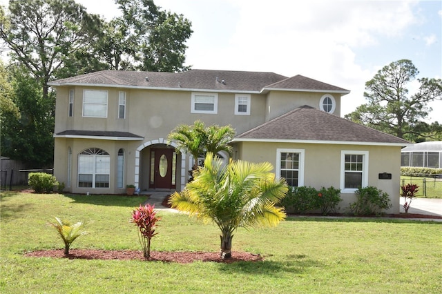 7508 Lake Marsha Dr, Orlando, FL 32819 - view of front of property featuring roof with shingles, stucco siding, a front yard, and fence
