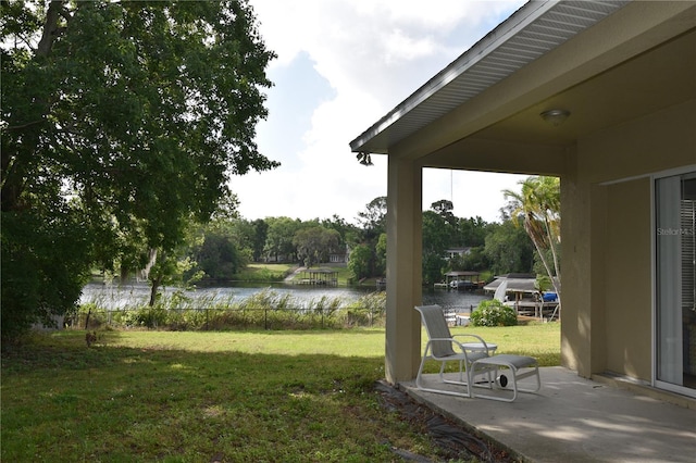 7508 Lake Marsha Dr, Orlando, FL 32819 - view of yard with a patio and a water view