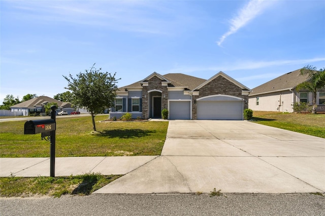 view of front of home with driveway, a front lawn, stone siding, and a garage
