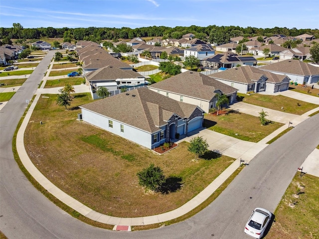 birds eye view of property with a residential view