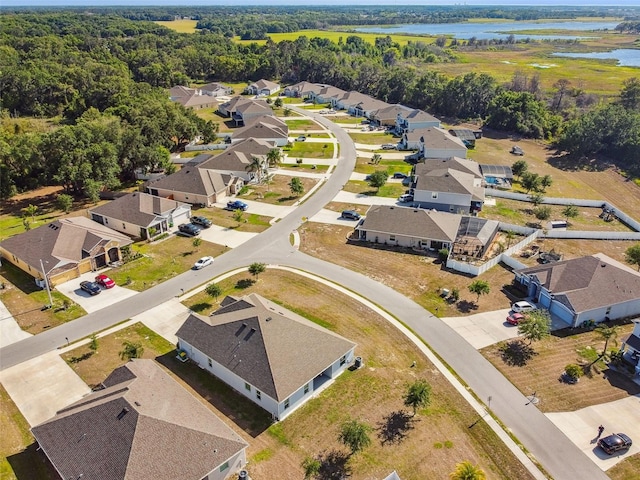 bird's eye view with a water view and a residential view