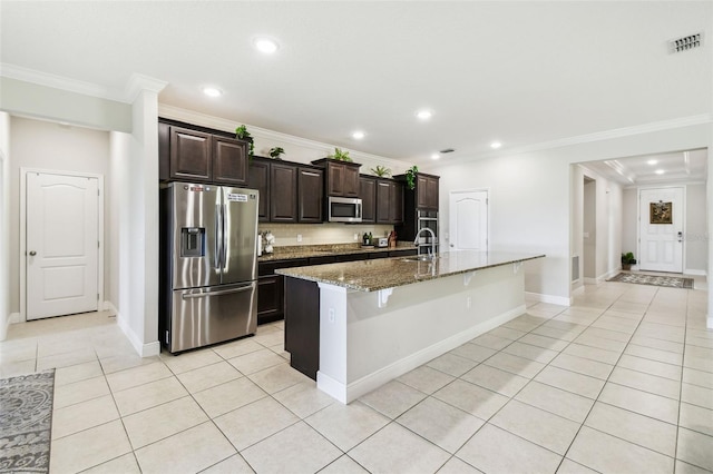kitchen with visible vents, a sink, appliances with stainless steel finishes, and crown molding