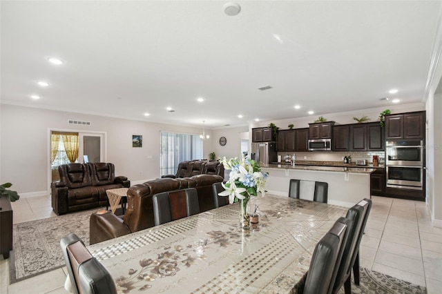 dining area with recessed lighting, visible vents, plenty of natural light, and light tile patterned floors
