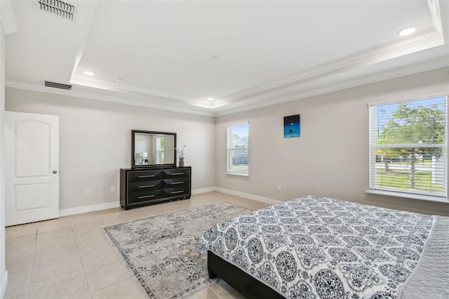 bedroom with crown molding, a raised ceiling, light tile patterned floors, and visible vents