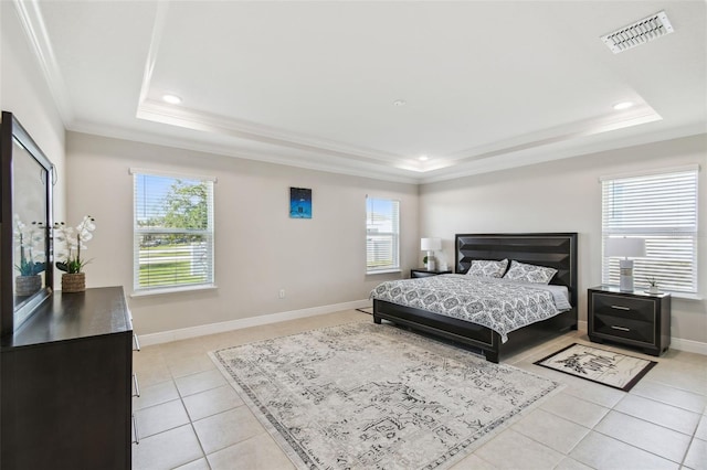 bedroom with visible vents, crown molding, light tile patterned floors, baseboards, and a tray ceiling