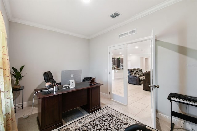 home office featuring light tile patterned floors, baseboards, ornamental molding, and visible vents