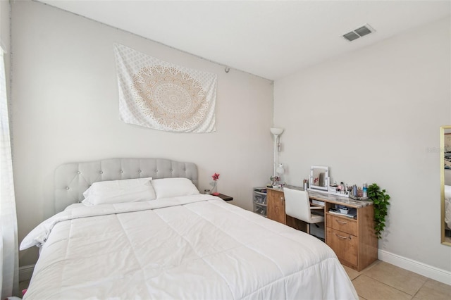 bedroom with baseboards, visible vents, and light tile patterned floors