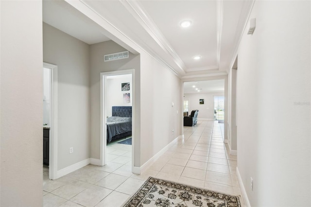 hall featuring visible vents, ornamental molding, baseboards, recessed lighting, and light tile patterned floors