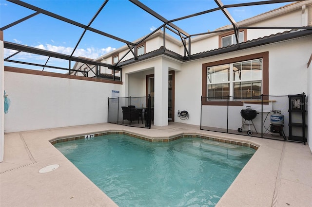 back of house featuring a patio, an outdoor pool, and stucco siding