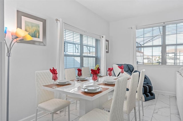 dining room featuring baseboards and marble finish floor