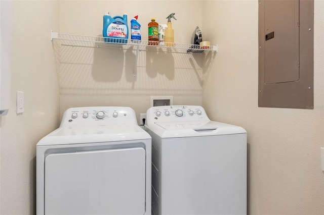 laundry room with separate washer and dryer, laundry area, and electric panel