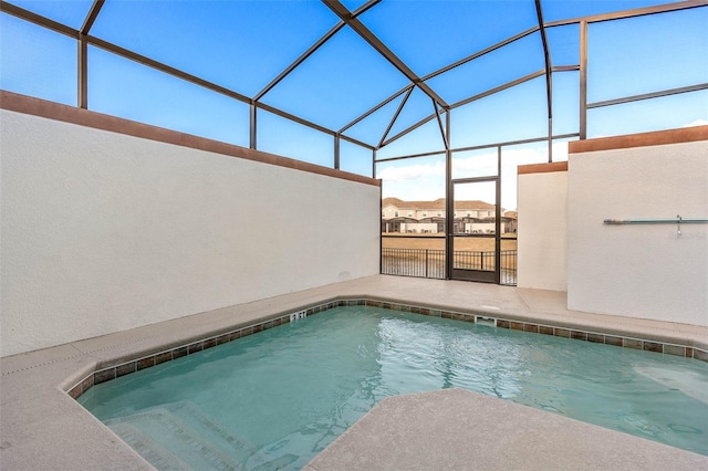 view of swimming pool with a patio area, a lanai, and a pool