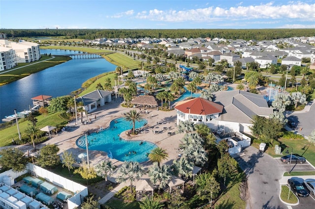 drone / aerial view with a residential view and a water view