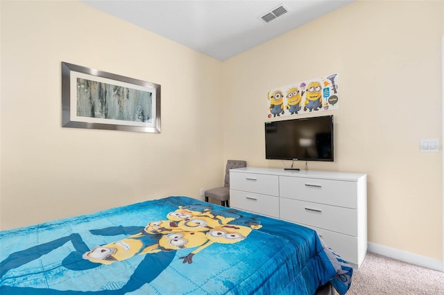 carpeted bedroom featuring baseboards and visible vents