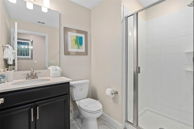 bathroom featuring vanity, a stall shower, toilet, and visible vents