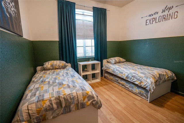 bedroom featuring wood finished floors