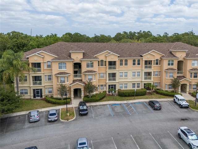 view of property with uncovered parking