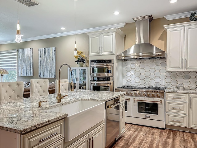 3008 Sutton Woods Dr, Plant City, FL 33566 - kitchen with wall chimney range hood, crown molding, appliances with stainless steel finishes, a sink, and visible vents