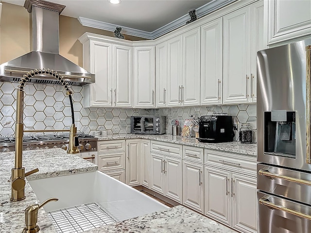 3008 Sutton Woods Dr, Plant City, FL 33566 - kitchen featuring decorative backsplash, a toaster, wall chimney range hood, white cabinetry, and stainless steel fridge with ice dispenser