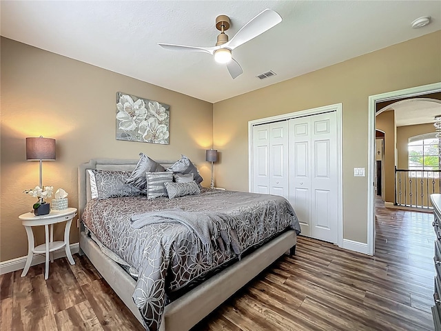 3008 Sutton Woods Dr, Plant City, FL 33566 - bedroom with arched walkways, a closet, wood finished floors, and visible vents
