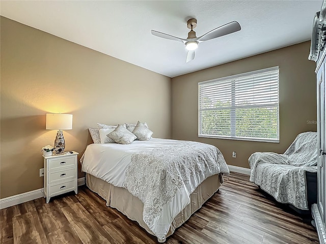 3008 Sutton Woods Dr, Plant City, FL 33566 - bedroom with baseboards, a ceiling fan, and dark wood finished floors