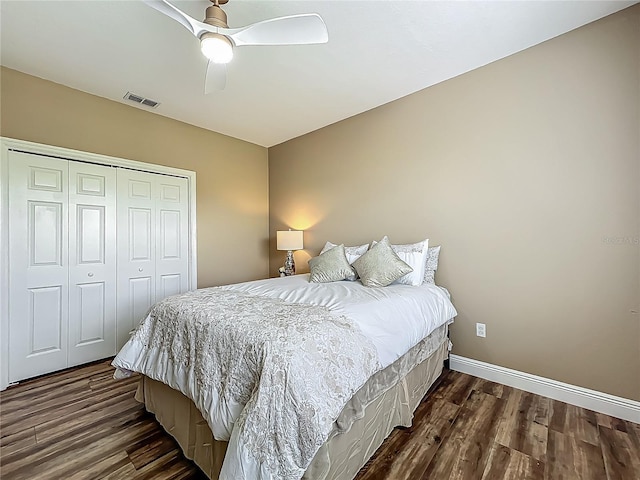 3008 Sutton Woods Dr, Plant City, FL 33566 - bedroom with visible vents, a closet, baseboards, dark wood-style floors, and a ceiling fan