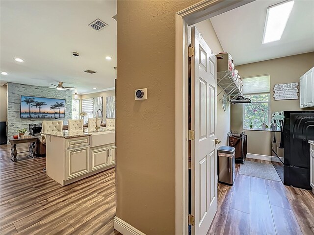3008 Sutton Woods Dr, Plant City, FL 33566 - washroom with cabinet space, baseboards, a wealth of natural light, and washer and clothes dryer