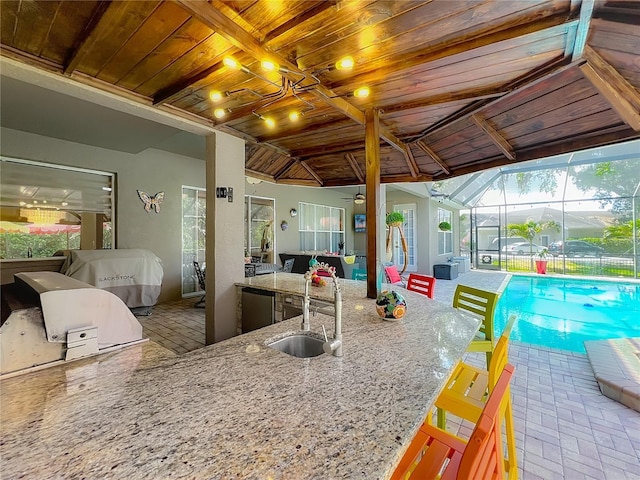 3008 Sutton Woods Dr, Plant City, FL 33566 - exterior space with ceiling fan, a lanai, exterior kitchen, a sink, and outdoor wet bar